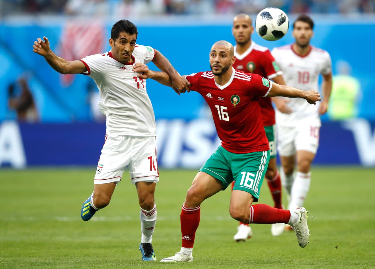 SAINT PETERSBURG, RUSSIA - JUNE 15: Vahid Amiri of Iran cb Noureddine Amrabat of Morocco during the 2018 FIFA World Cup Russia group B match between Morocco and Iran at Saint Petersburg Stadium on June 15, 2018 in Saint Petersburg, Russia. (Photo by Julian Finney/Getty Images)