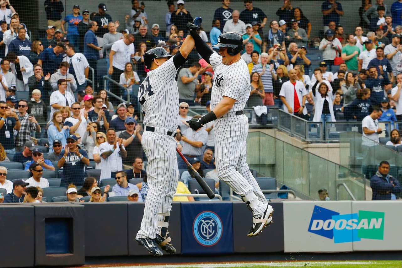 NEW YORK, NY - SEPTEMBER 22: Luke Voit #45 of the New York Yankees celebrates with Gary Sanchez #24 after hitting a home run in the second inning against the Baltimore Orioles at Yankee Stadium on September 22, 2018 in the Bronx borough of New York City. (Photo by Mike Stobe/Getty Images)