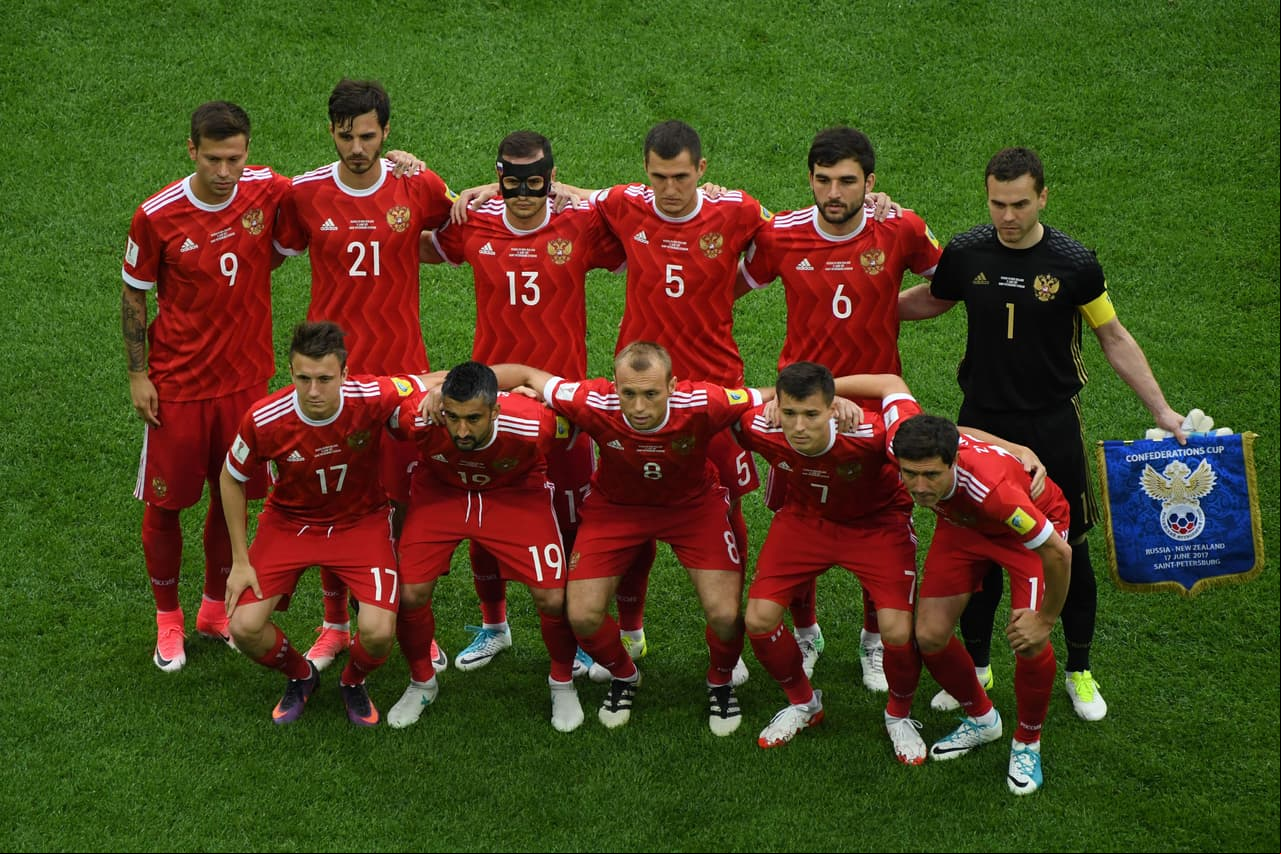 Players from the Russian national football team pose for a group photo from back left: Russia's forward Fedor Smolov, Russia's midfielder Alexander Erokhin, Russia's defender Fedor Kudryashov, Russia's defender Viktor Vasin, Russia's defender Georgiy Dzhikiya, Russia's goalkeeper Igor Akinfeev and bottom row from left: Russia's midfielder Alexander Golovin, Russia's midfielder Alexander Samedov, Russia's midfielder Denis Glushakov, Russia's forward Dmitry Poloz, and Russia's midfielder Yury Zhirkov during the 2017 Confederations Cup group A football match between Russia and New Zealand at the Krestovsky Stadium in Saint-Petersburg on June 17, 2017. (Photo by FRANCOIS XAVIER MARIT / AFP) (Photo credit should read FRANCOIS XAVIER MARIT/AFP/Getty Images)