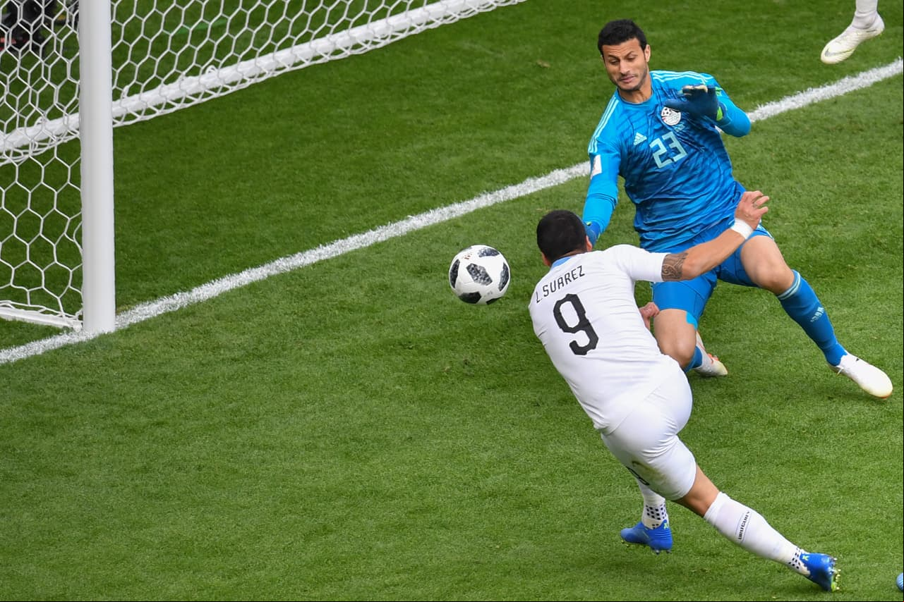 Uruguay's forward Luis Suarez (L) fires the ball into the side netting missing a chance during the Russia 2018 World Cup Group A football match between Egypt and Uruguay at the Ekaterinburg Arena in Ekaterinburg on June 15, 2018. (Photo by HECTOR RETAMAL / AFP) / RESTRICTED TO EDITORIAL USE - NO MOBILE PUSH ALERTS/S (Photo credit should read HECTOR RETAMAL/AFP/Getty Images)